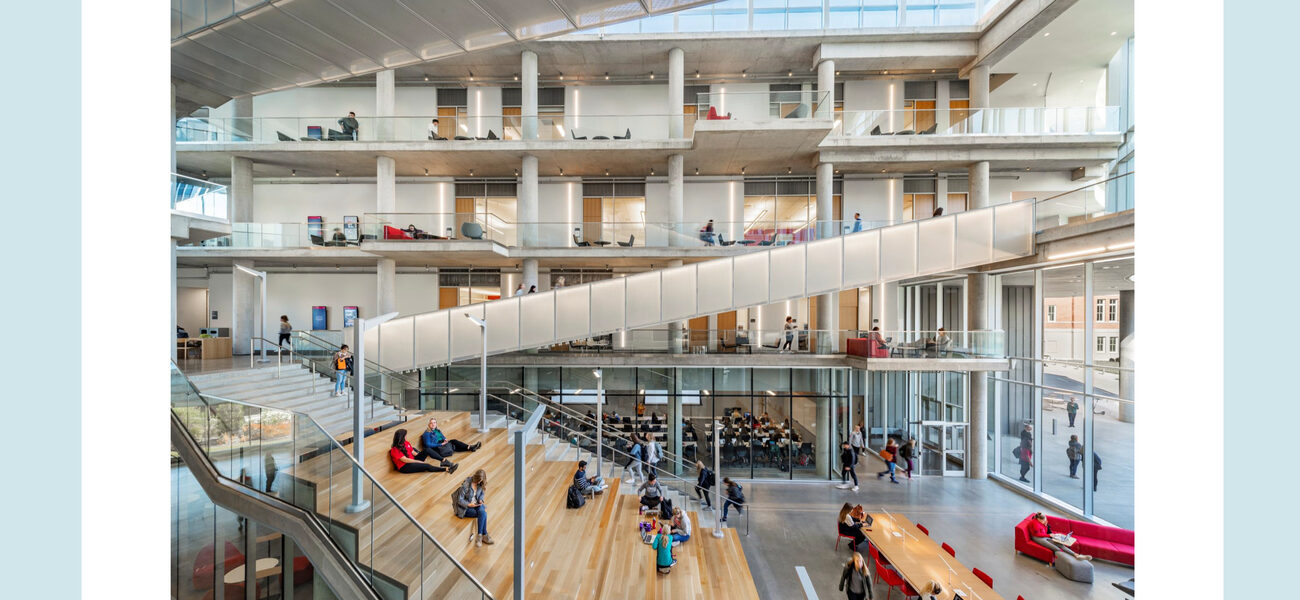 Large interior atrium space where all four stories and a staircase are visible.