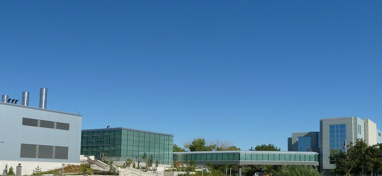 Row of connected concerte and glass building.