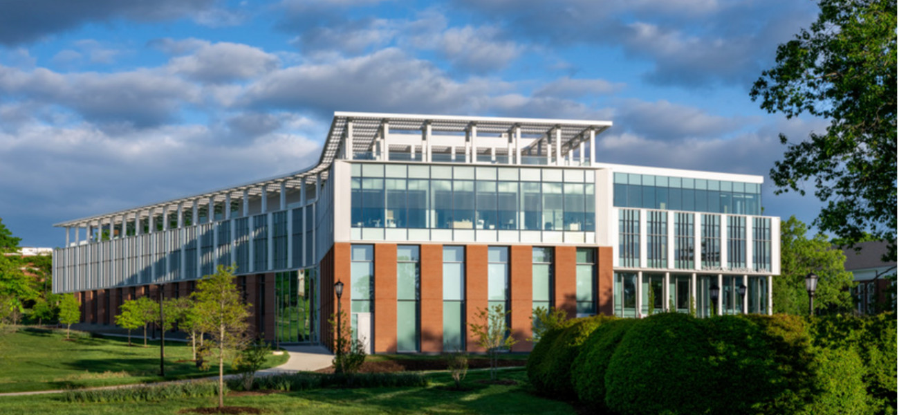 Building exterior showing an upper level covered in glass.