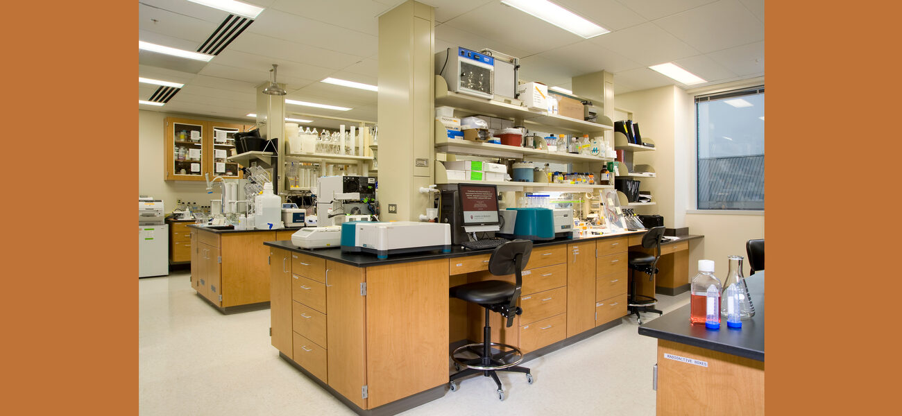 A laboratory with two lab benches filled with scientific equipment