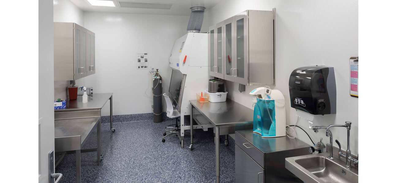 Small lab with stainless steel tables and sink