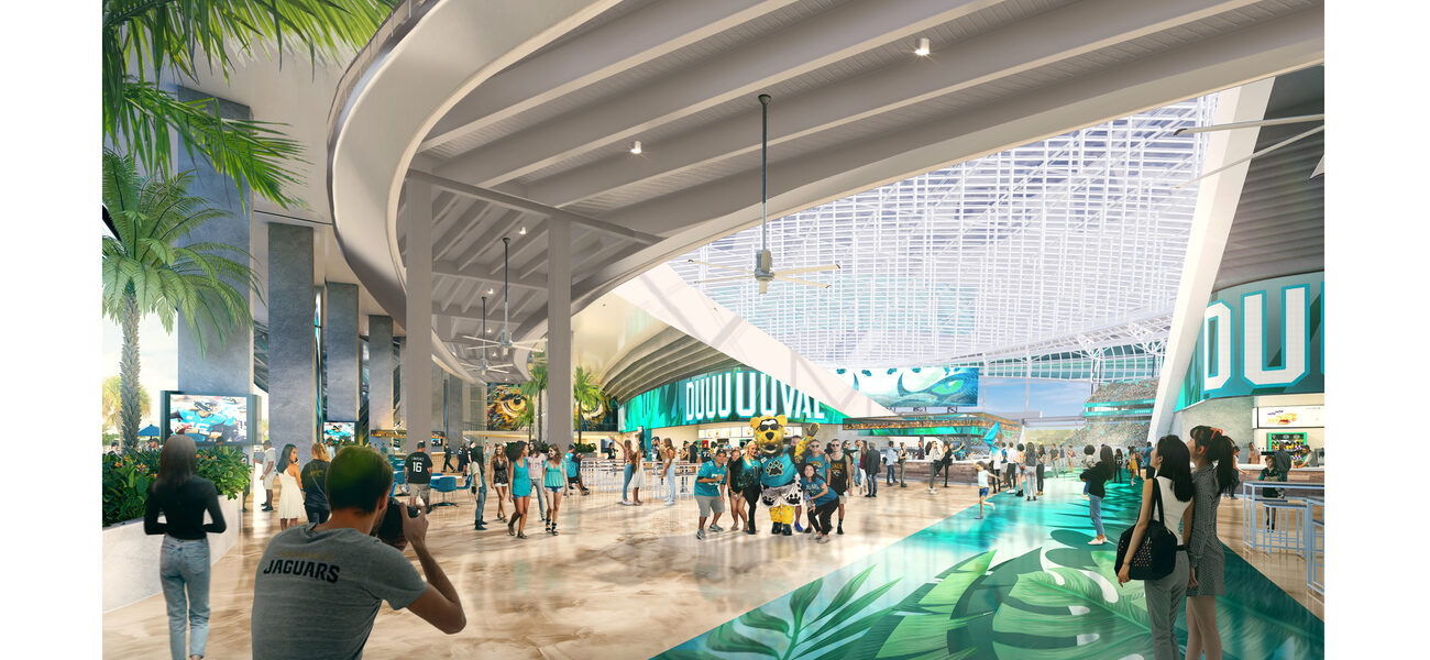 A large indoor space with palm trees people milling around.