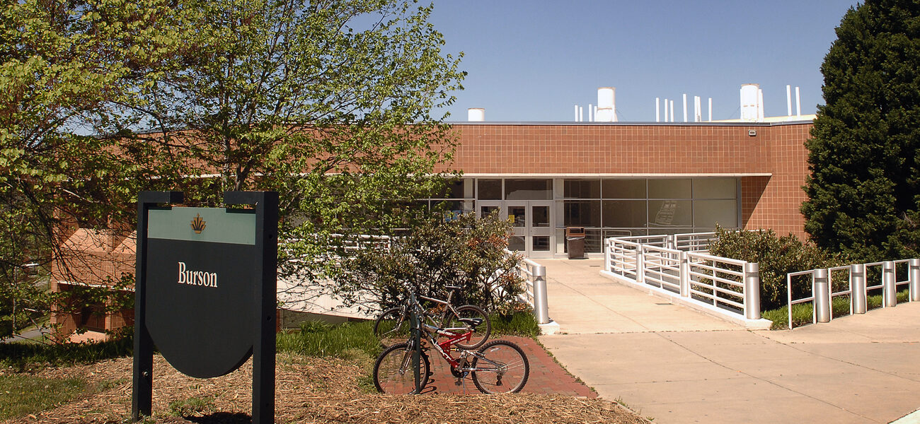 Low brick building with bicycles parked in front