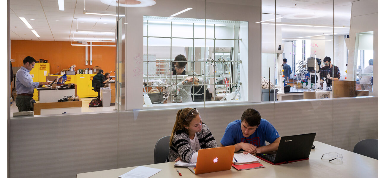 Researcher work in an enclosed lab space