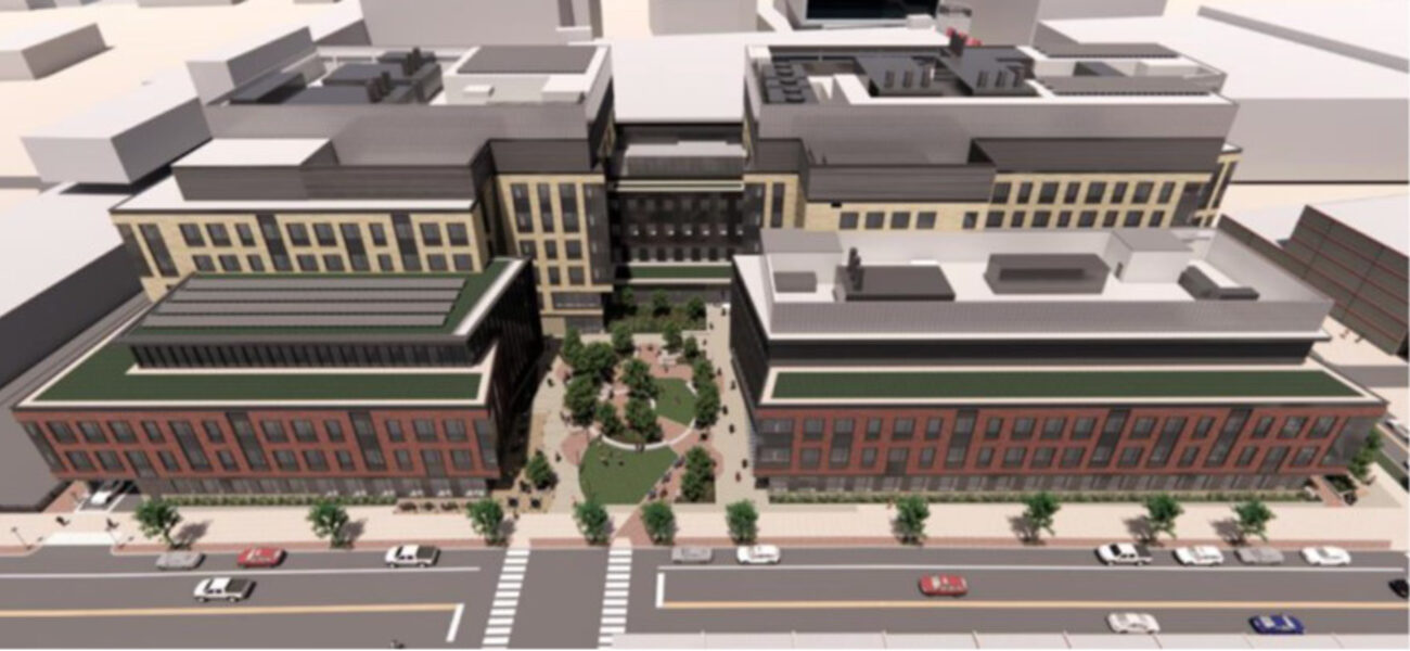 Aerial view of a group of large buildings with a courtyard in the middle