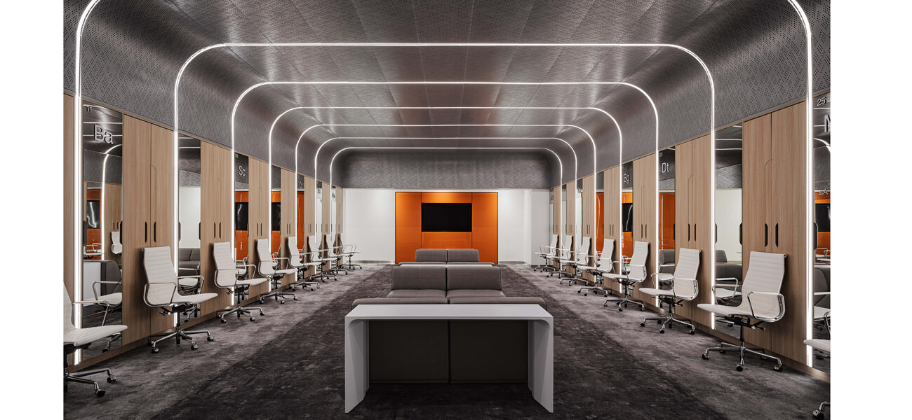 A long room lined on each side with wood-panelled lockers