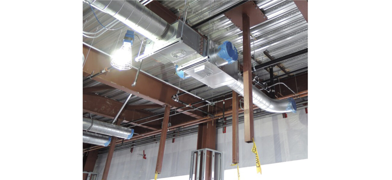 A ceiling with pipes hanging down