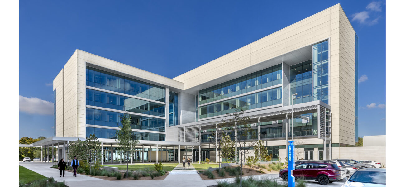 Large building covered almost entirely in glass.