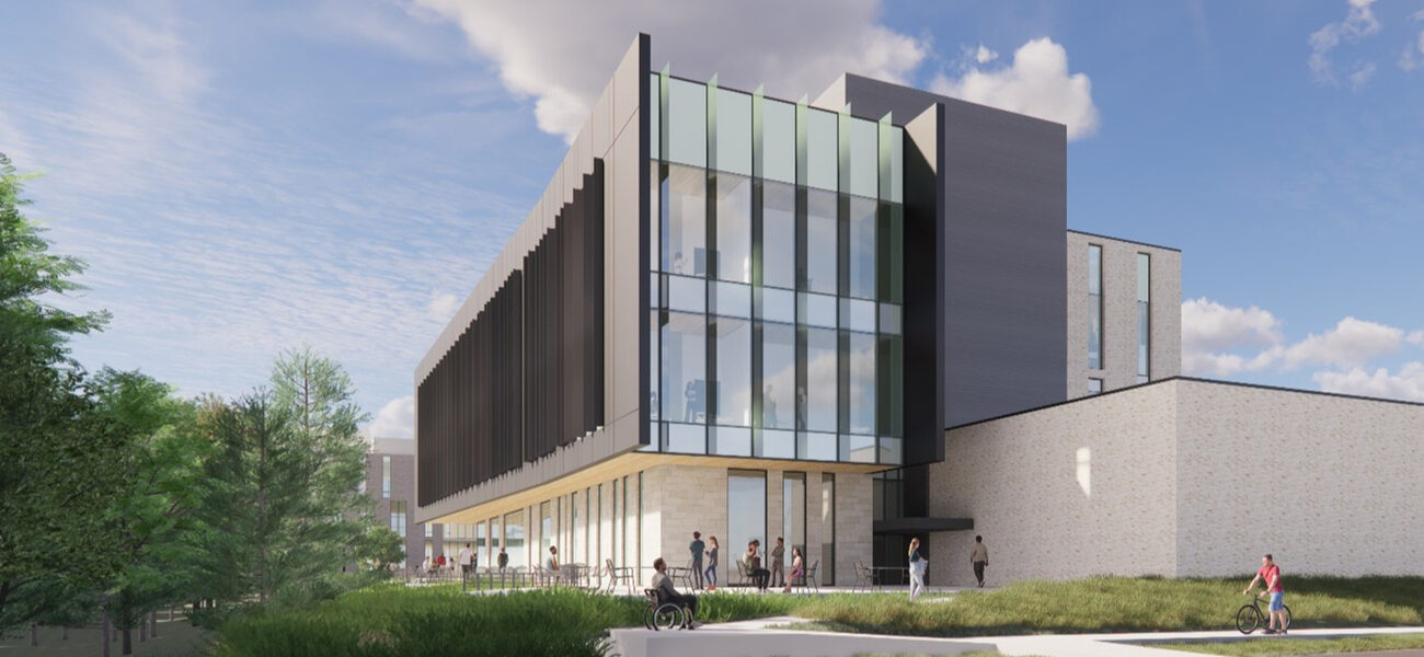 Large building with concrete on the bottom and glass on top.