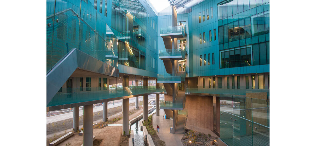 large interior space surrounded by glassed-in walls several stories high.