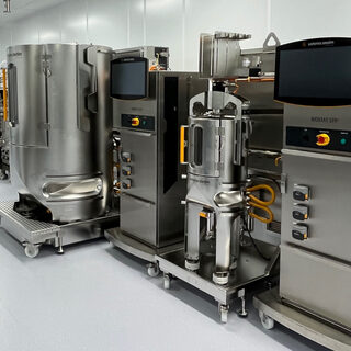 A wall lined with stainless steel lab equipment