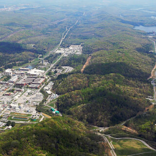 Aerial photo shows many buildings among hills