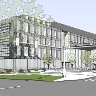 Exterior of a large four-story building made partially of brick