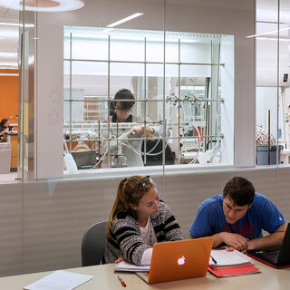 Researcher work in an enclosed lab space