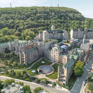 Aerial view of a campus of old stone buildings
