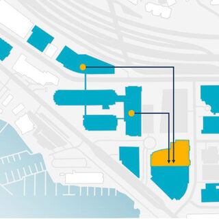 A diagram with dots showing buildings on a map, and arrows pointing to other buildings