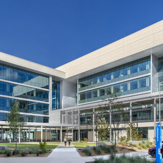 Large building covered almost entirely in glass.