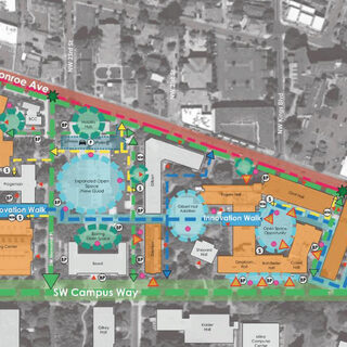 Map showing a number of buildings inside a triangle-shaped area bordered by three roads.
